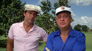 Chevy Chase (with G-d, right)
